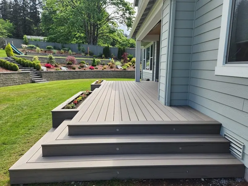 Composite deck steps down to a lawn