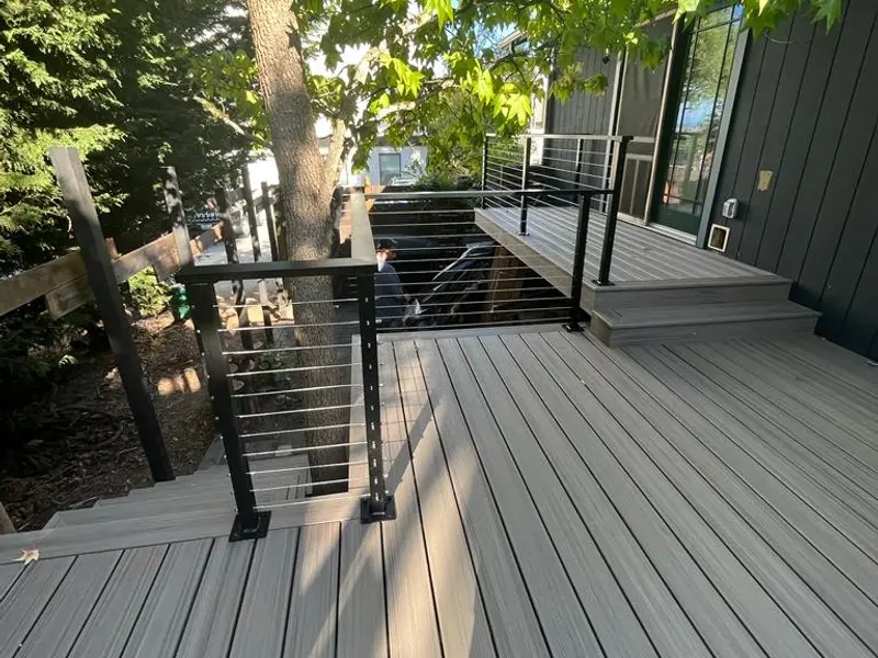 Gray composite deck with cable railing