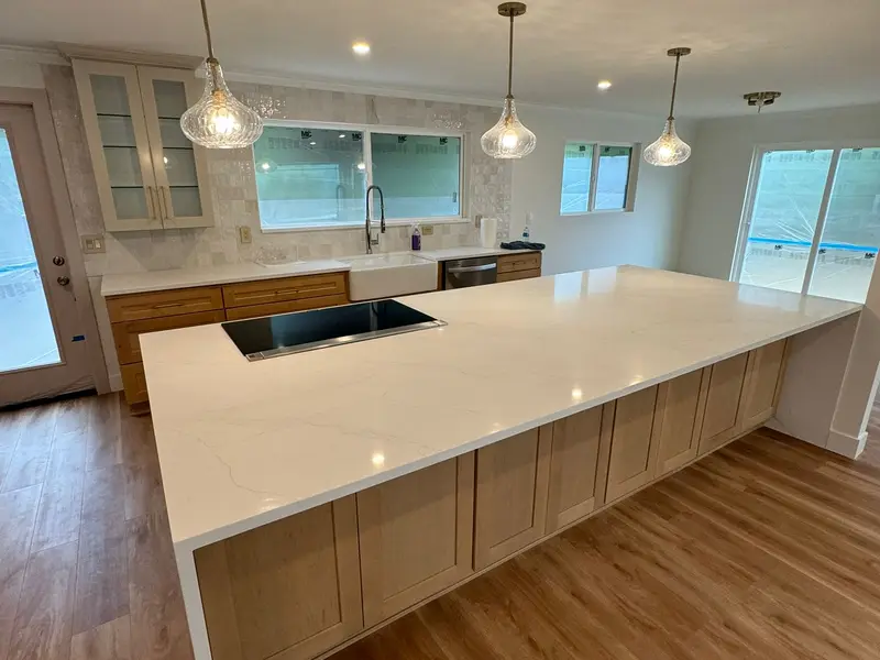Kitchen with white waterfall island