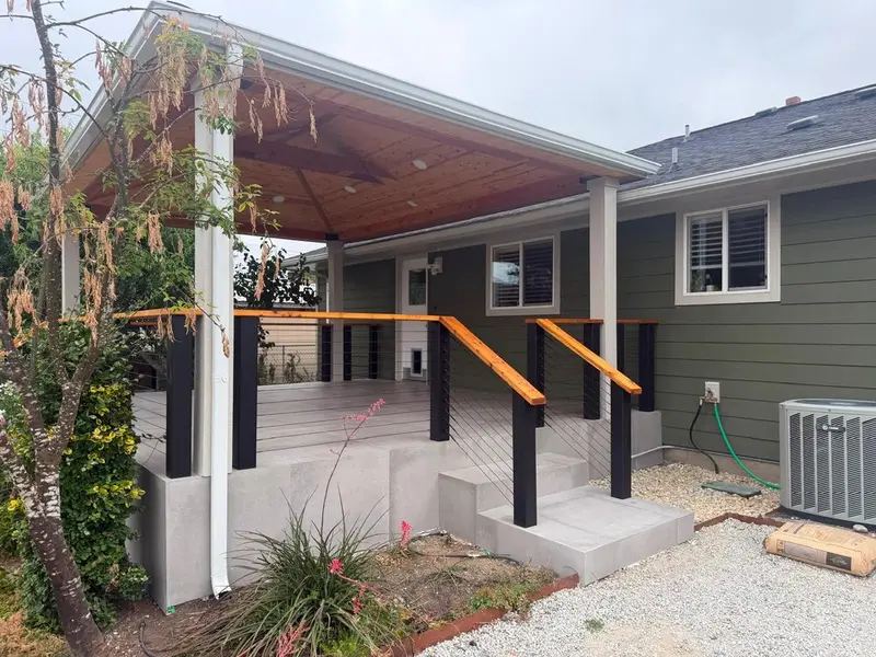 Covered porch with wood ceiling and new steps